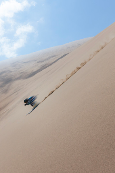 Mahe skiing down the dune