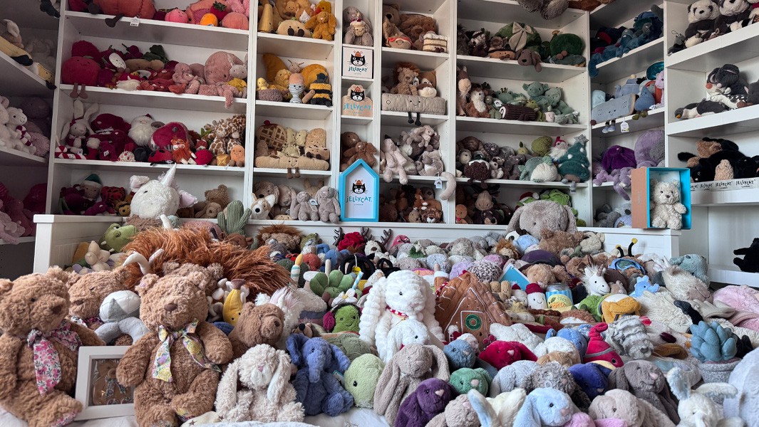 Wide shot of a collection of Jellycat toys