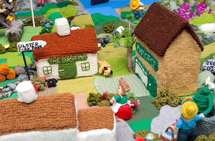 knitted houses and dog peeing