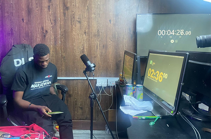 record holder sitting at a computer