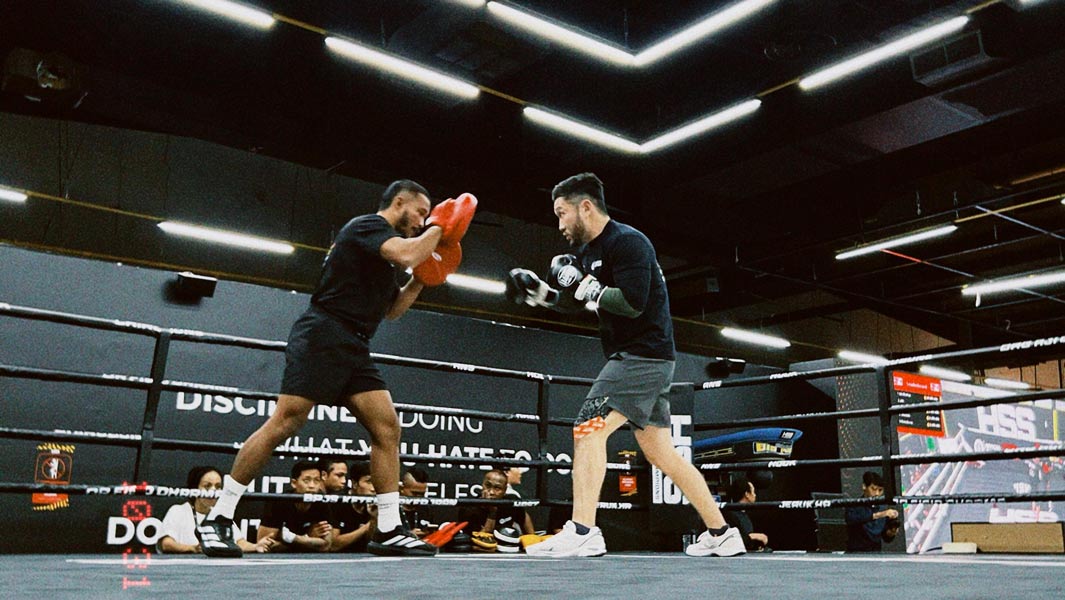 Split image most boxing pad punching rounds low angle shot of the ring
