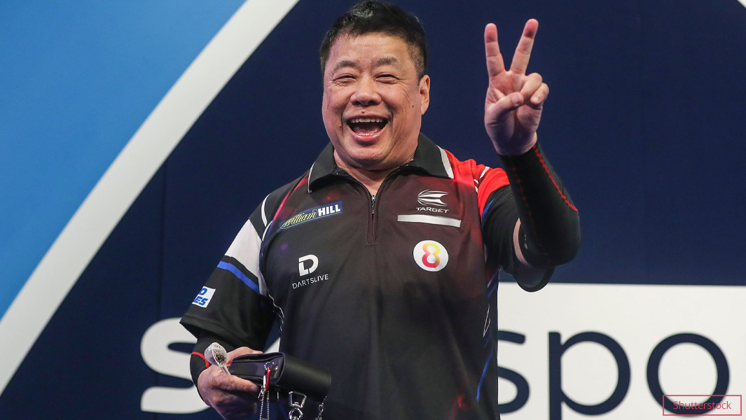 Paul Lim smiling and holding a peace sign with his fingers