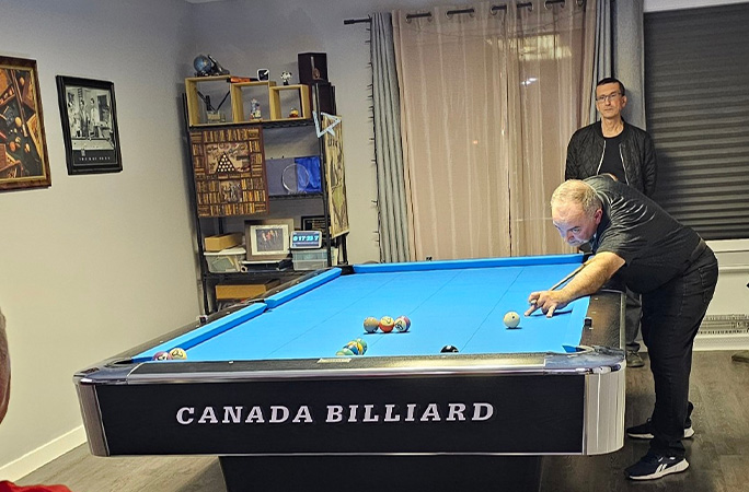 Nick leaning over the table