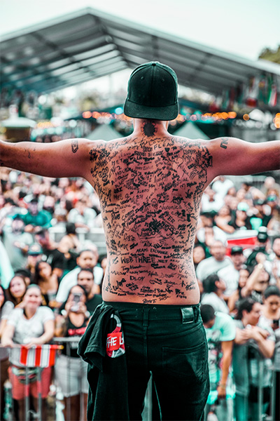 Funky standing topless in front of a crowd