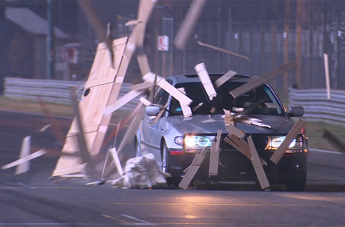 The car drives through the box