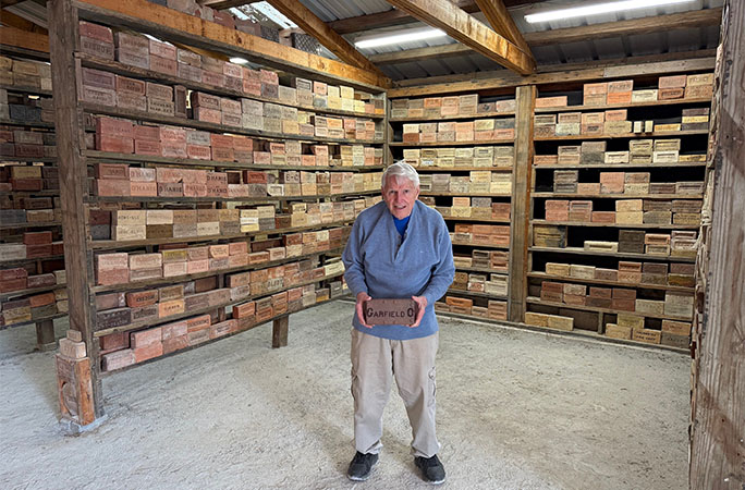 Clem posing with his bricks