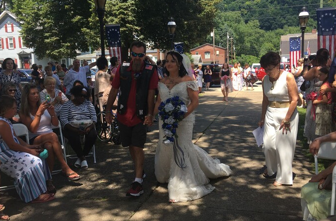 A couple walking down the aisle