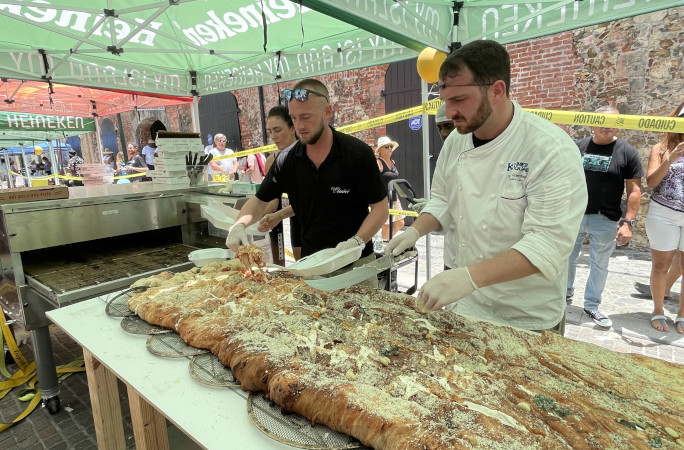 Picture of workers and the giant calzone 