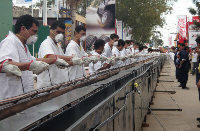 Picture of the team assembling the hot dogs.