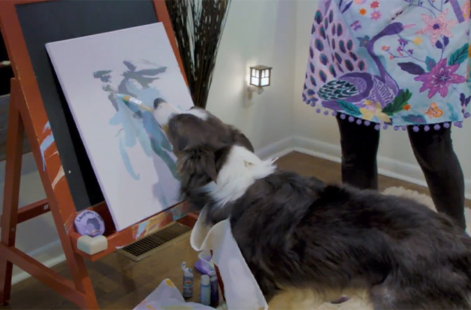 Leonard Lee painting on a canvas
