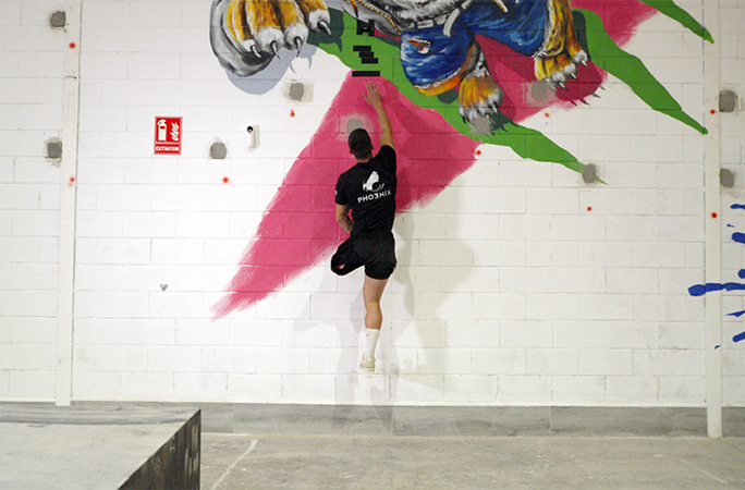 Ruben jumping as high as he can up a wall
