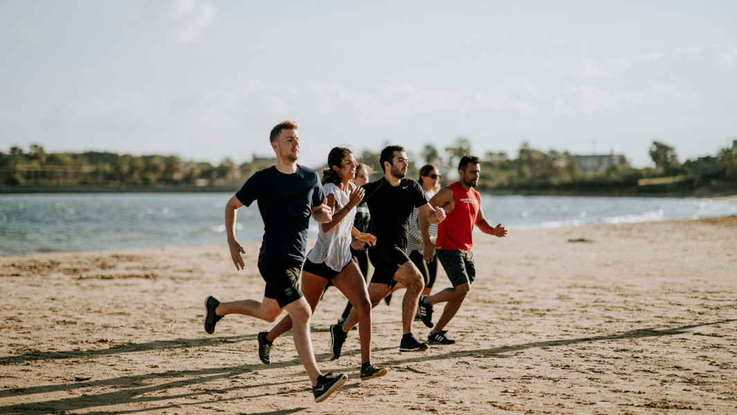 People running on the beach