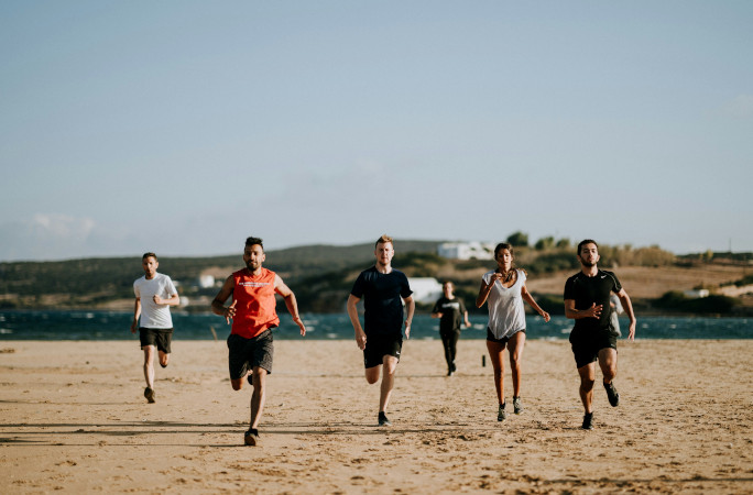 People running on the beach