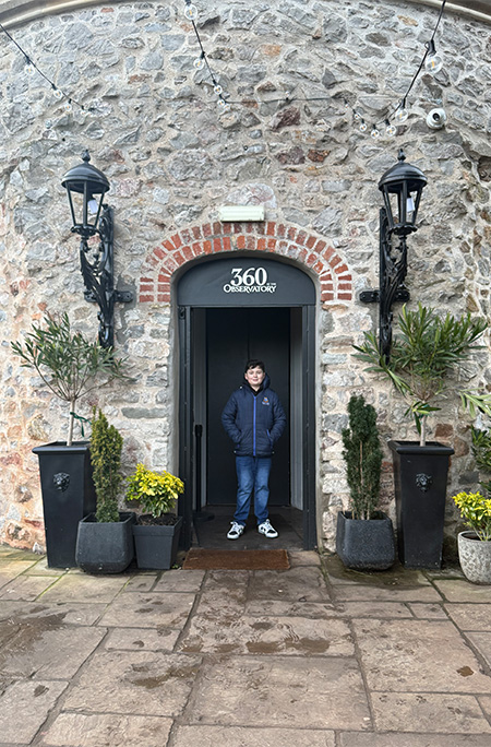 Alberto posing in front of door