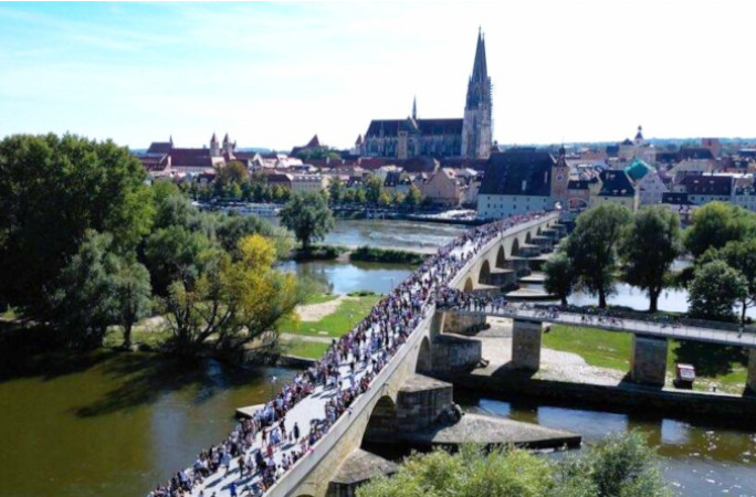 Marching across the old stone bridge