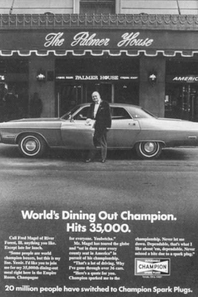 Fred Mangel standing in front of a car for an ad