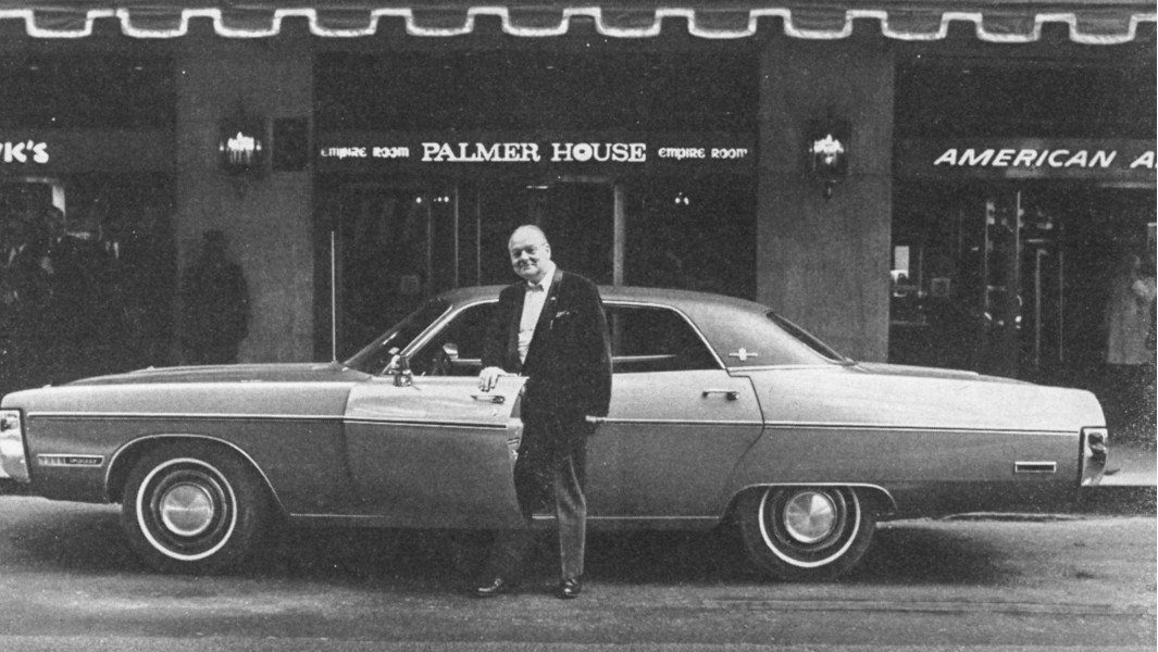 Fred Magel posing with his car