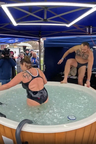 people switching out in the ice bath relay