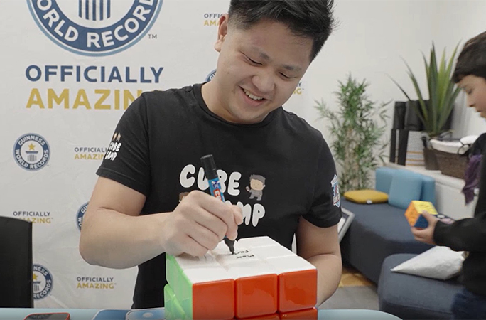 Max signing a cube