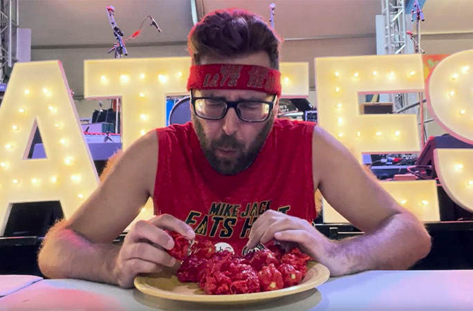 Mike Jack struggling while eating the peppers