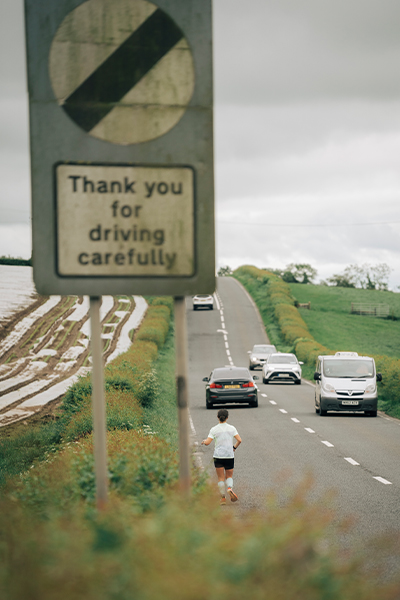 Sophie running along a road in Ireland