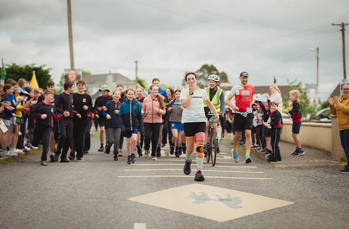 Sophie with a crowd of people behind her in Ireland