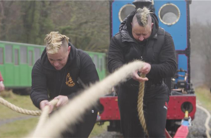 Steam train being pulled along a track