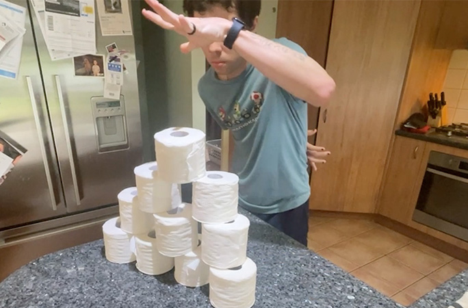 Brendan stacking toilet rolls
