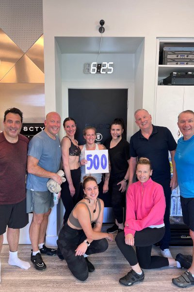 Heather celebrating with her cycling friends