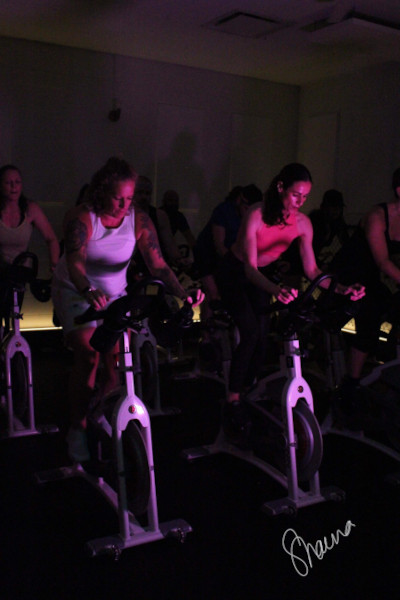 Heather cycling next to a friend