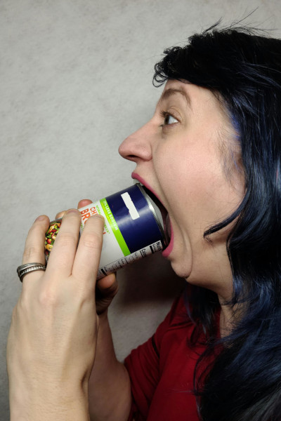 Marie with a can in her mouth