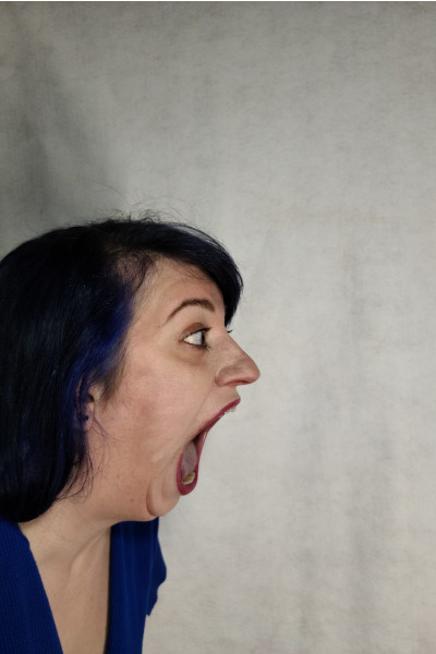 Marie's open mouth from the side