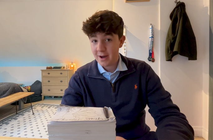 Max speaking in front of flip book