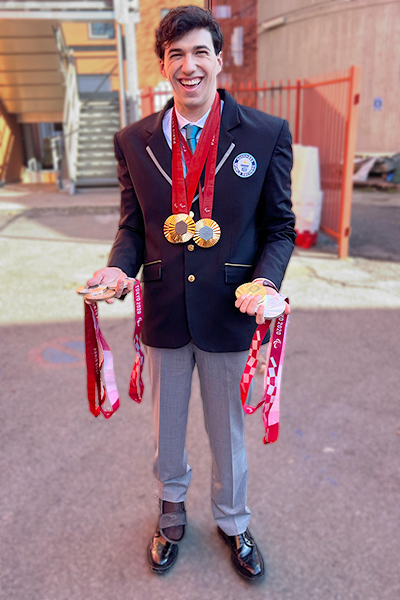 Simone smiling with medals