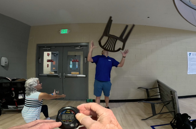 David correcting the falling chair