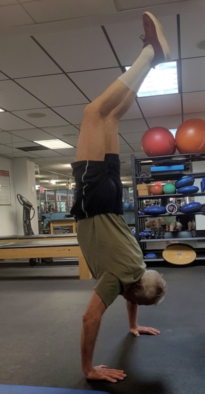 Paul doing a handstand in his local gym