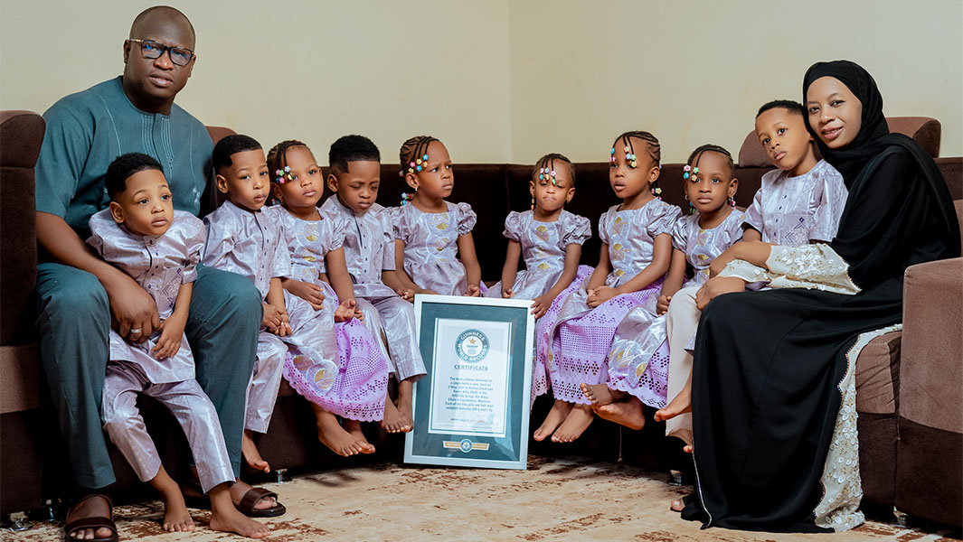 The Mali nonuplets posing with their parents