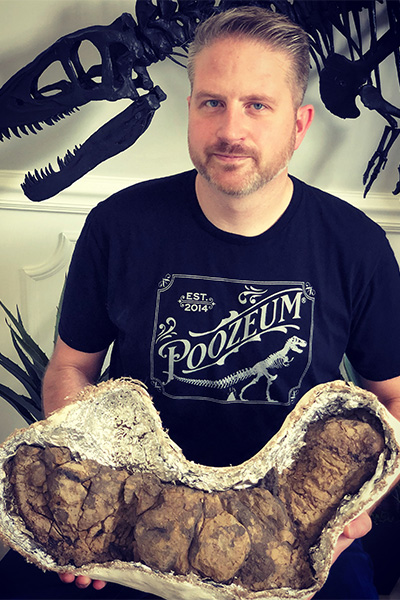 George Frandsen holding the largest coprolite