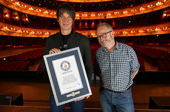 Professor Brian Cox with certificate