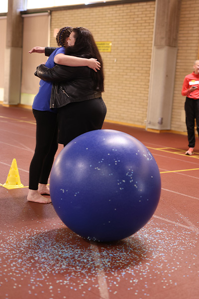 Jasmin getting a hug from her mum