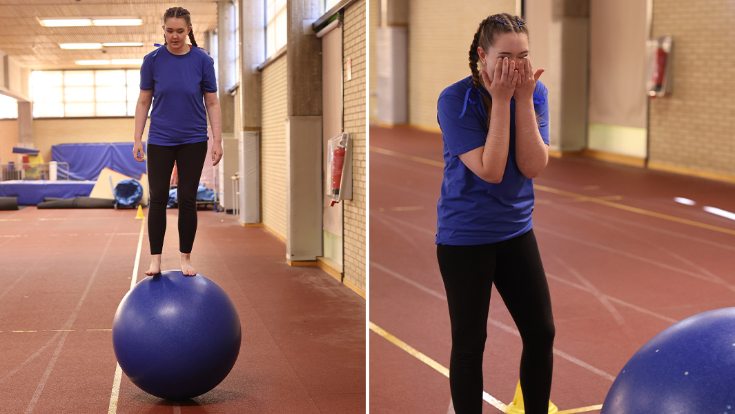 Jasmin walking on a rolling globe and bursting into tears of joy