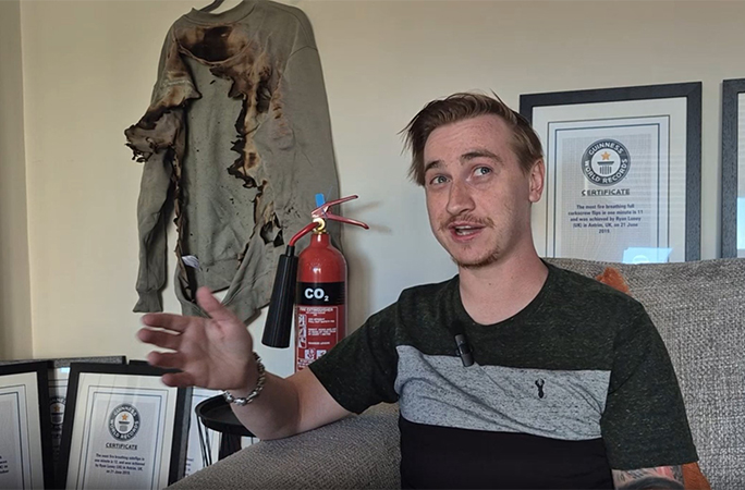 Ryan with his burned sweatsuit and GWR certificates