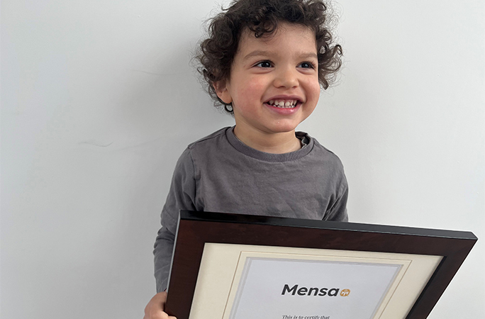 Joseph with his Mensa certificate 