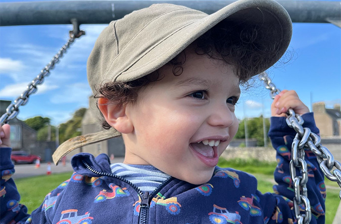 Joseph on a swing