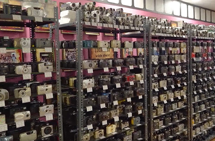 shelves full of cameras