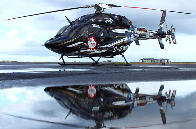 helicopter with reflection in the water