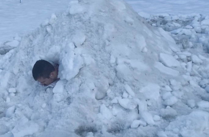 Elias facedown in the snow