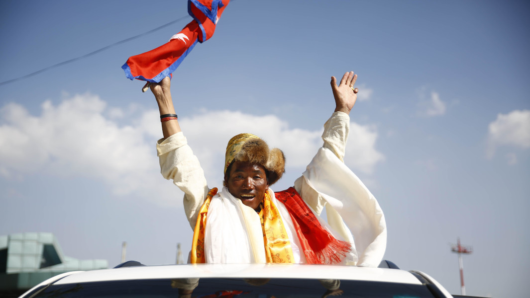 Kami Rita Sherpa riding in a parade after climbing Everest