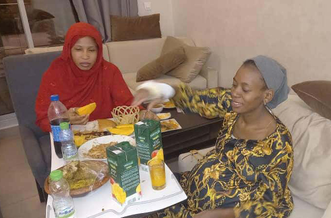 Pregnant Halima having a meal