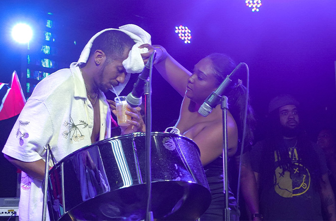 Joshua having his brow wiped and being given a drink
